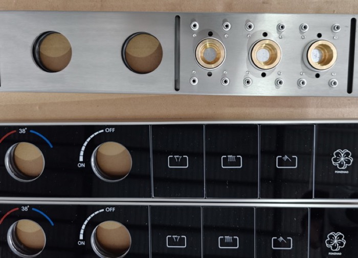 Private label trim plates and valve bodies on a workbench