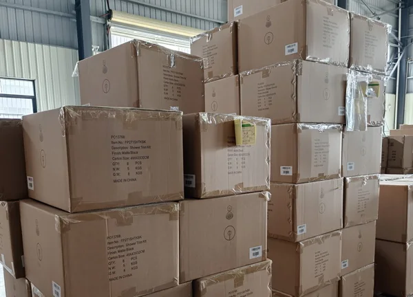Packed shower faucet cartons in the factory